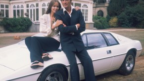 1977: Barbara Bach and Roger Moore, stars of the James Bond film 'The Spy Who Loved Me' leaning on the now-famous 'amphibious' Lotus Esprit. (Photo by Hulton Archive/Getty Images). Jay Leno also loves this classic sports car.