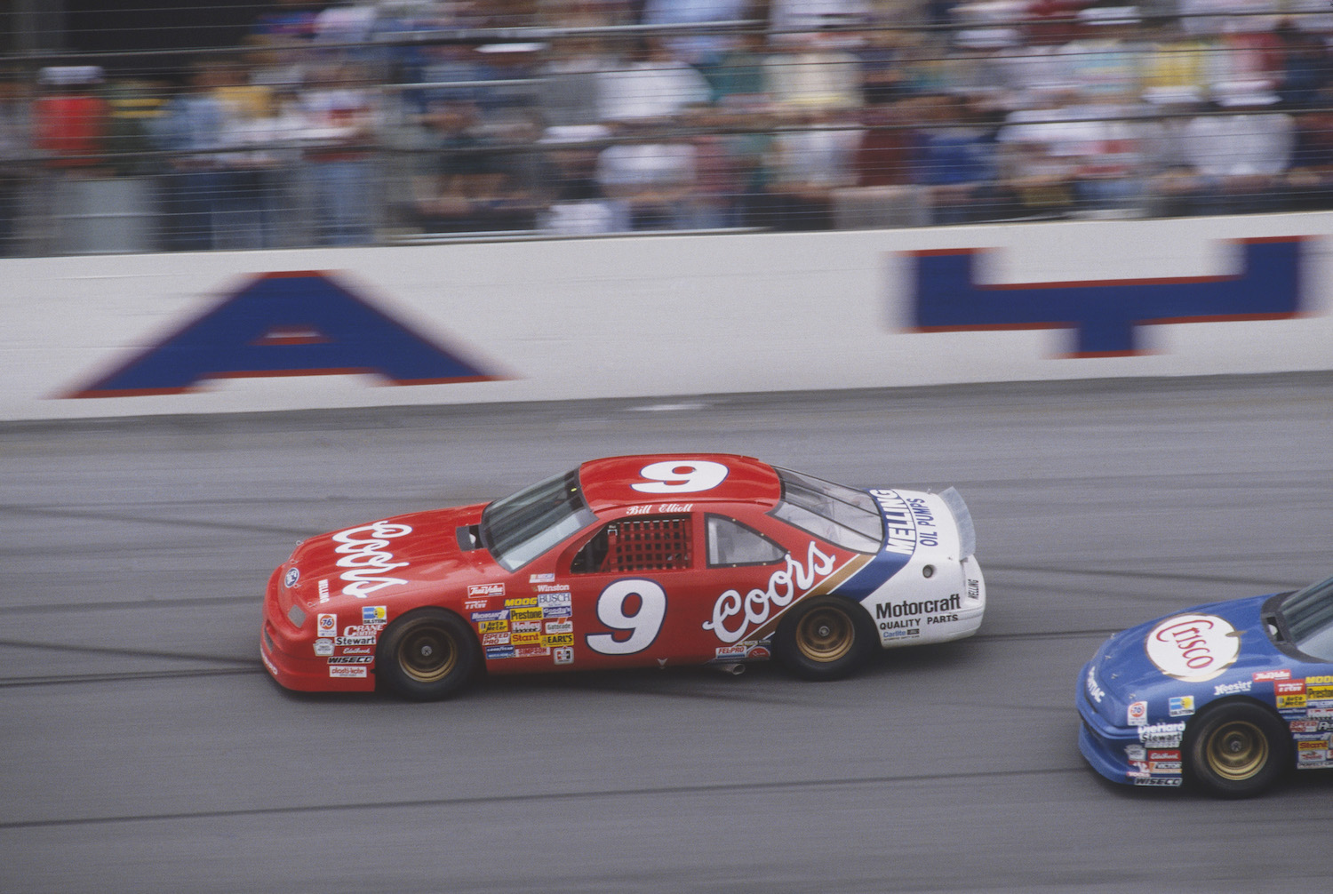 Bill Elliott driving the Coors Ford Thunderbird #9 car. In 1987 Bill Elliott would set a top-speed NASCAR record while qualifying at Talladega that would last for over thirty years. | Photo by Focus on Sport/Getty Images