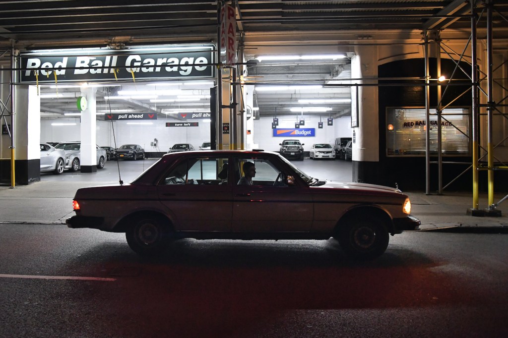 NEW YORK, NEW YORK - SEPTEMBER 17: Dmitry Cherkassky, 40, of Philadelphia checks the GPS on more time outside the Red Ball Garage in a Mercedes 1983 300 D just after 6 am as he waits for his partner Bert Potts September 17, 2016 in New York, New York. The two first-timers were part of the 2016 C2C Express - an homage to the Cannonball Runs of the 1970's - trying to make it from NY to CA as quickly as possible. (Photo by Katherine Frey/The Washington Post via Getty Images), The C2C is separate from the Cannonball Record.