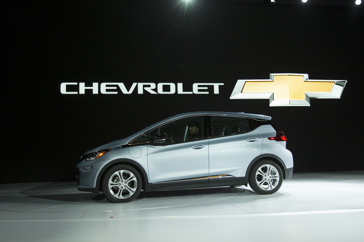 The Chevrolet Bolt drives onstage during a press conference at the 2017 North American International Auto Show in Detroit. Chris Pratt drives a 2017 Chevy Bolt in The Tomorrow War as part of GM's Ultium product placement | GEOFF ROBINS/AFP via Getty Images