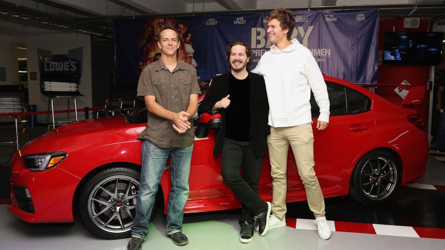 Stuntman Jeremy Fry, film director Edgar Wright and actor Ansel Elgort in front of one of the cars in baby driver: a 2006 Subaru Impreza WRX. (Photo by Victor Chavez/Getty Images)
