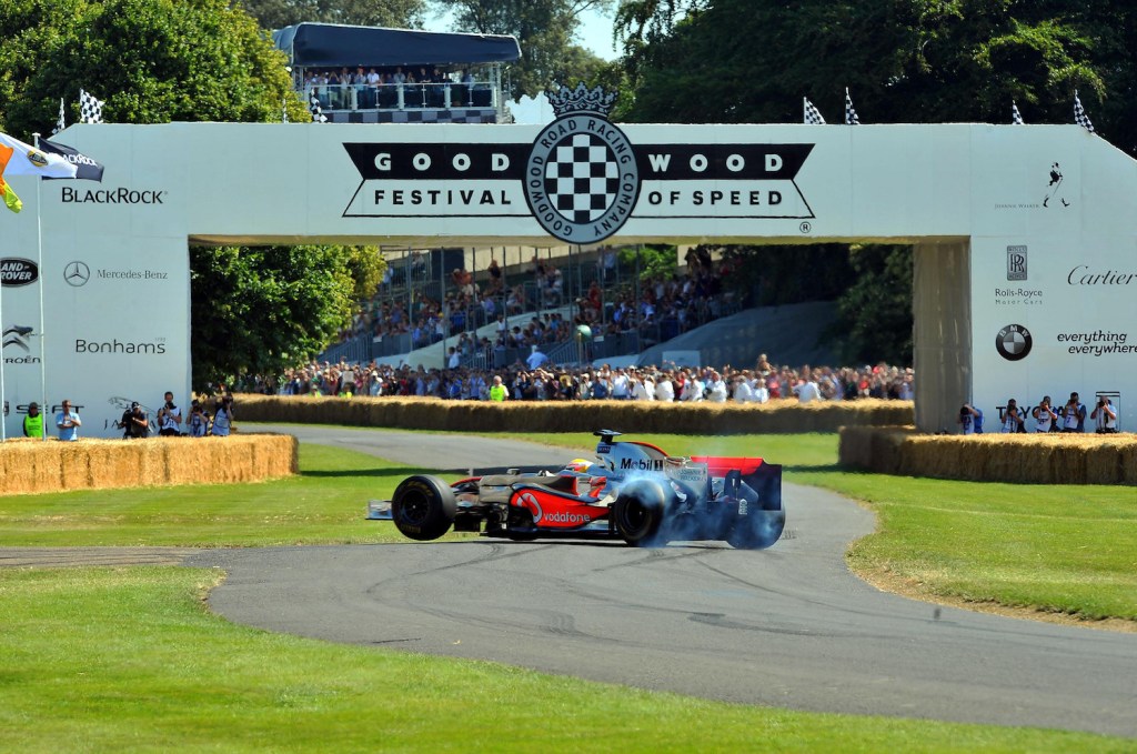 Lewis Hamilton driving a McLaren MP4/23 F1 car, performs wheel spins as he takes part in the hill climb event at the Goodwood Festival of Speed in Chichester, West Sussex. (Photo by Clive Gee/PA Images via Getty Images)