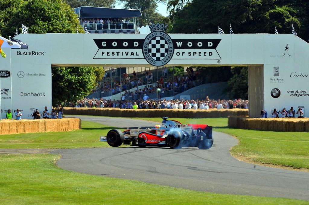 Lewis Hamilton driving a McLaren MP4/23 F1 car, performs wheel spins as he takes part in the hill climb event at the Goodwood Festival of Speed in Chichester, West Sussex.   (Photo by Clive Gee/PA Images via Getty Images)