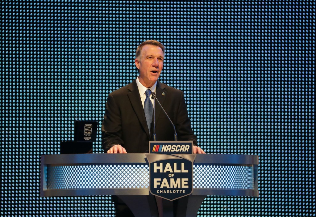 CHARLOTTE, NC - JANUARY 19: Governer of Vermont, Phil Scott, speaks during the NASCAR Hall of Fame Induction Ceremony at Charlotte Convention Center on January 19, 2018 in Charlotte, North Carolina. (Photo by Streeter Lecka/Getty Images) Governor Phil Scott is a race car driver, Vermont set a COVID vaccination record.