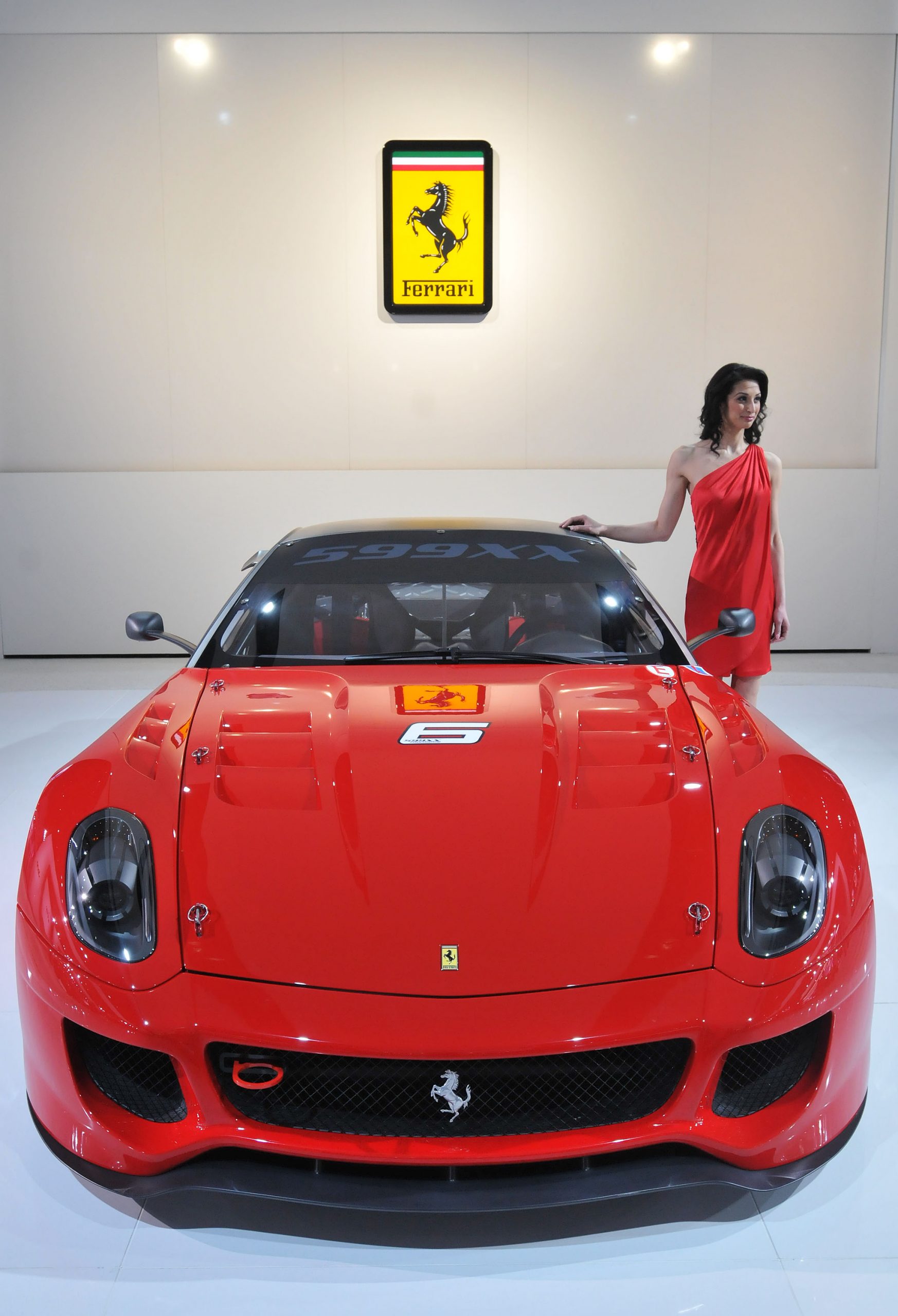 A red Ferrari 599xx Evolution at the Detroit Auto Show, shot from the front