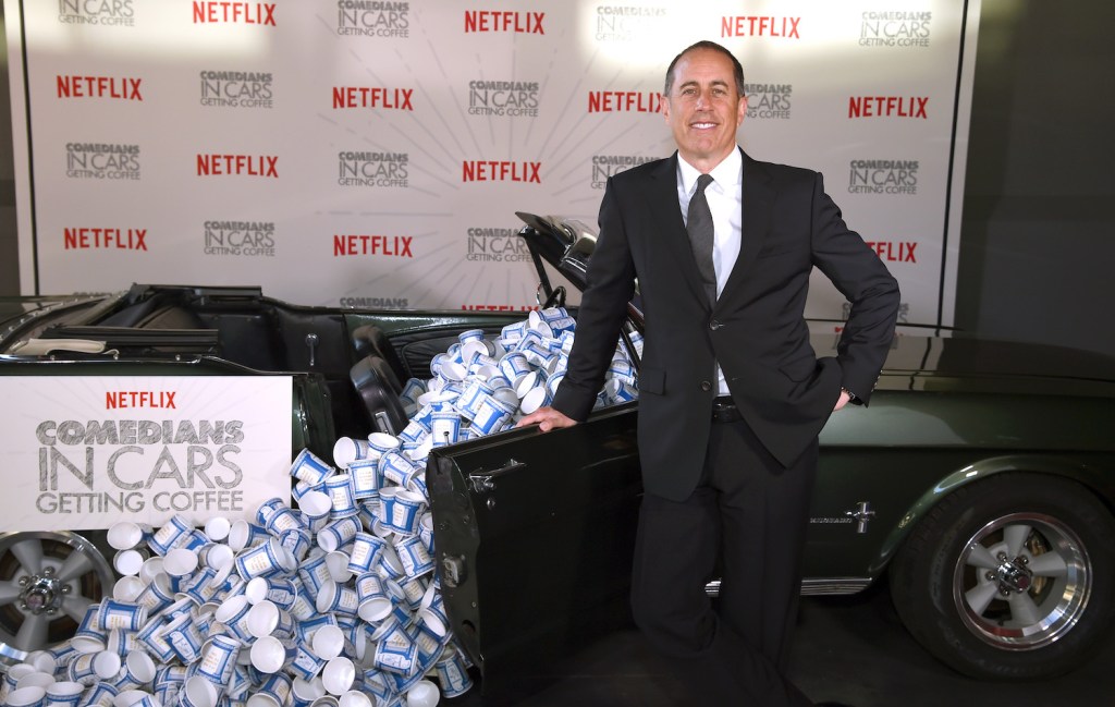 Jerry Seinfeld and a Mustang promo for Comedians in Cars Getting Coffee - New York Event at Classic Car Club Manhattan on June 25, 2018 in New York City. He picked up Seth Rogen in a 1976 Dodge Monaco retired police car. Dimitrios Kambouris/Getty Images for Netflix