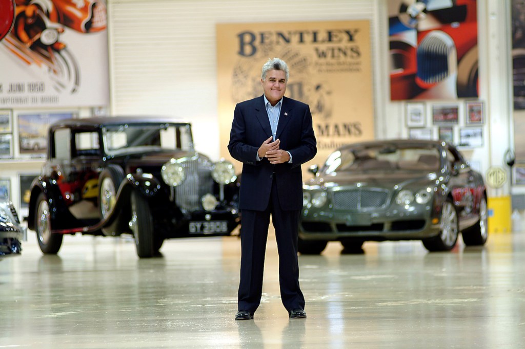 Jay Leno stands in one of his 3 car storage facilities with a 1931 Straight 8 Bentley he owns and a 2004 Bentley S2 which he roadtested for an Englsih Newspaper. American Television personality Jay Leno who host's the late night NBC "Tonight Show" collects cars. In 3 warehouses in a secure complex on the edge of Burbank airport he has over 100 cars, all insured, all in working order. The collection includes Bentleys, Bugatti's, McClaren, Cadillac, Hispano Suiza, Lamborgini, Morgans, Jaguars, there is also a collection of over 75 working motorcycles from the early 1920"s to a modern day Jet Bike. Photos Paul Harris, PacificCoastNews.com. The Jay Leno daily driver is a Tesla.