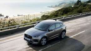 Gray 2021 Jaguar E-PACE driving on a coastal road