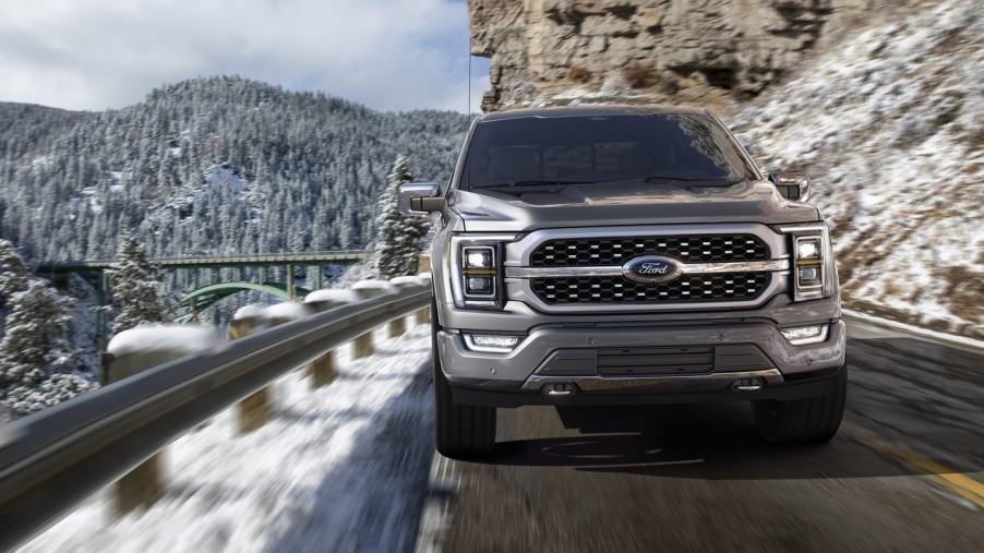 Gray 2022 Ford F-150 driving on a mountainous road