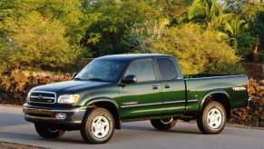 Green 2006 Toyota Tundra parked near a forest
