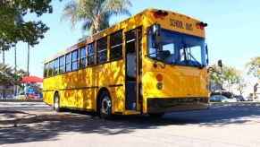 GreenPower BEAST school bus driving in a parking lot