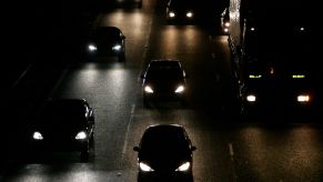 Sets of headlights on a highway.