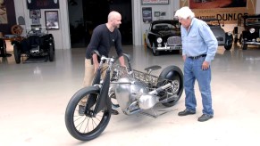 Jay Leno admires the Revival Birdcage with Revival Cycles CEO and founder Alan Stulberg