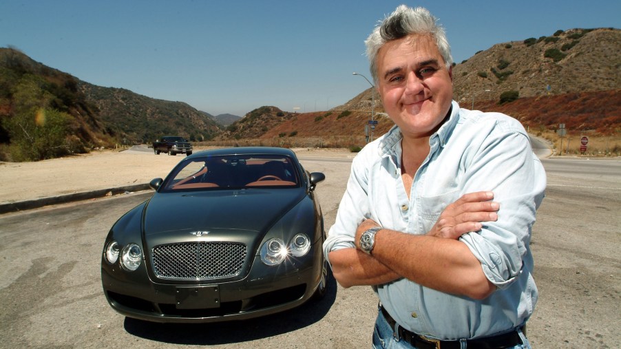 Celebrity car collector Jay Leno stands next to a 2004 Bentley S2 coupe