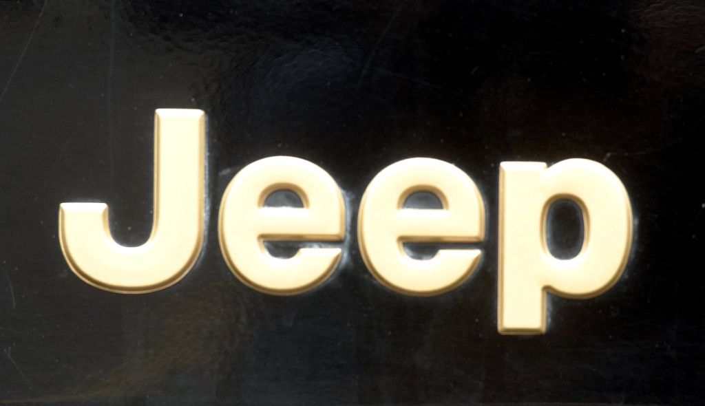 A cream Jeep logo on a black background.