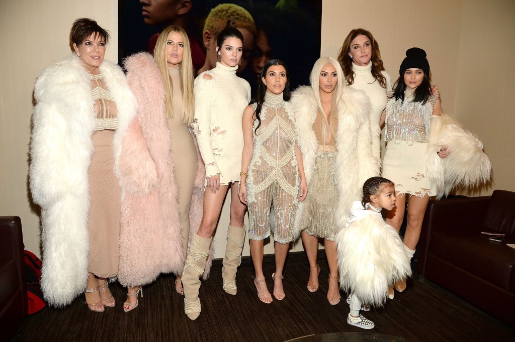 Members of the Kardashian-Jenner family dressed in fur jackets and other high end clothing. 