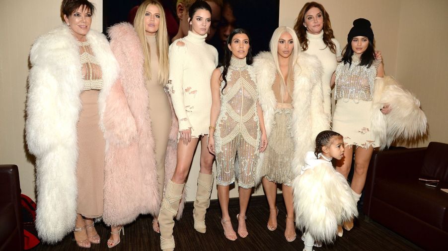 Members of the Kardashian-Jenner family dressed in fur jackets and other high end clothing.