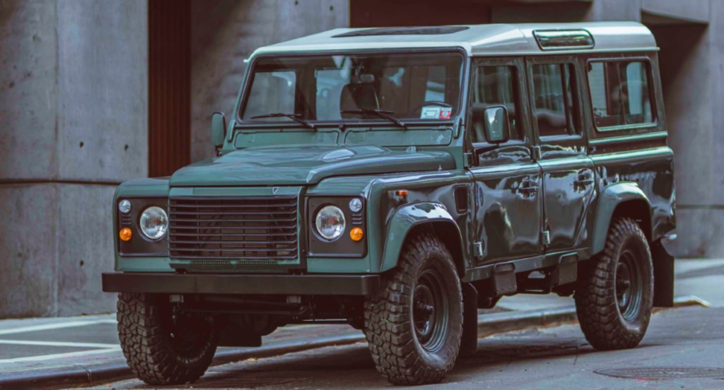 A custom-built Land Rover Defender 110 by Brooklyn Coachworks is parked. The vehicle was restored and modified by Brooklyn Coachworks. 
