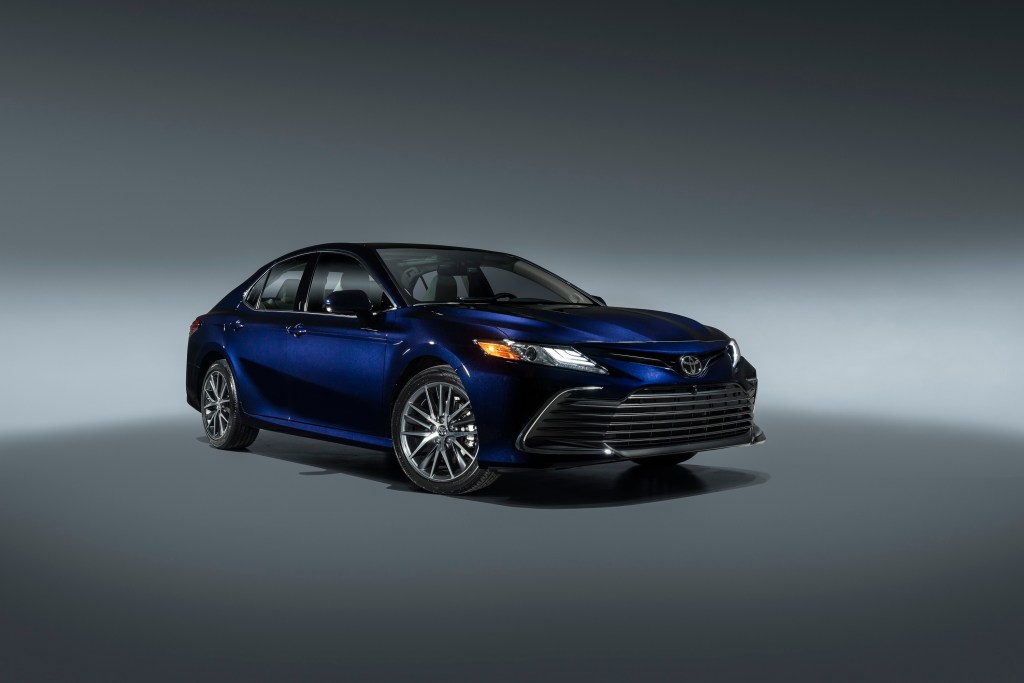 A dark blue 2021 Toyota Camry in a photo booth