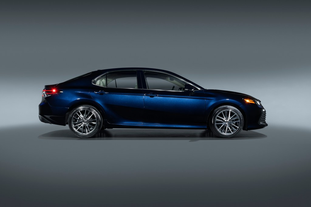 A side profile shot of a dark blue Toyota Camry