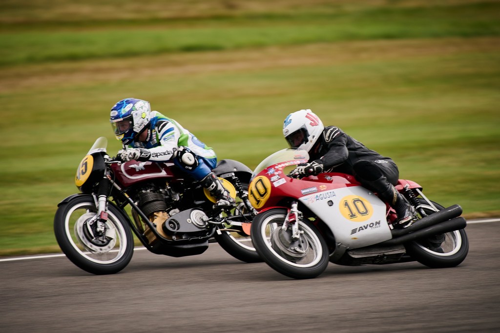 Michael Dunlop on a red-and-silver MV Agusta 500/3 racing Peter Bardell on a maroon-and-black Matchless G50 at the 2021 Goodwood Revival