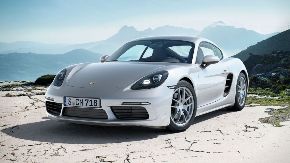 A sliver Porsche 718 Cayman which is similar to the Porsche featured in the drag race video in this article.