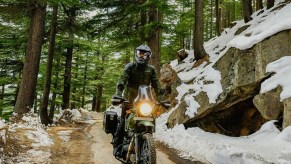 The 2021 Himalaya riding through the forest. This bike is one of the best beginner motorcycles.