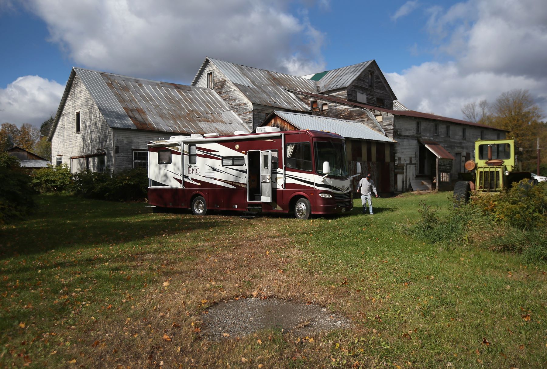 A recovery repo agent retrieving an RV parked on a farm