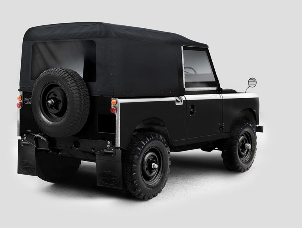 Rear angle view of modified electric black Land Rover Series IIA