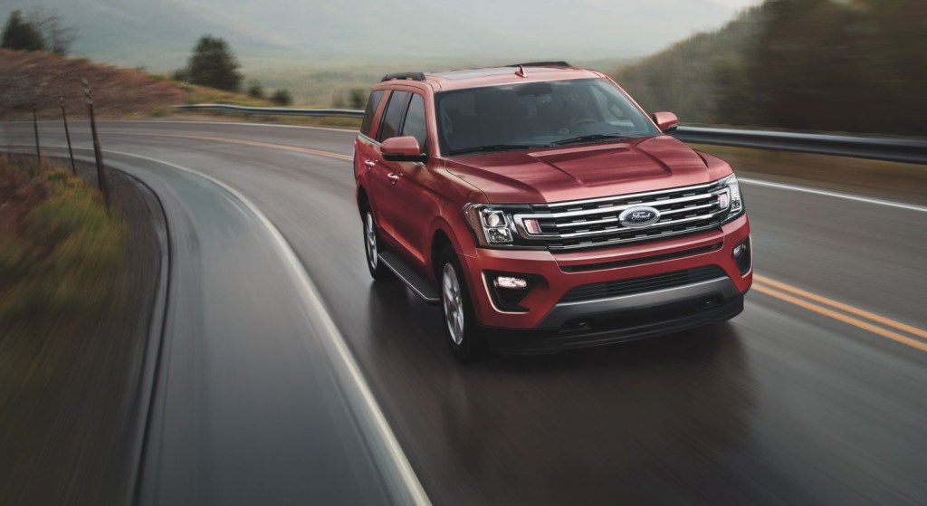 Red 2021 Ford Expedition driving on a mountainous highway