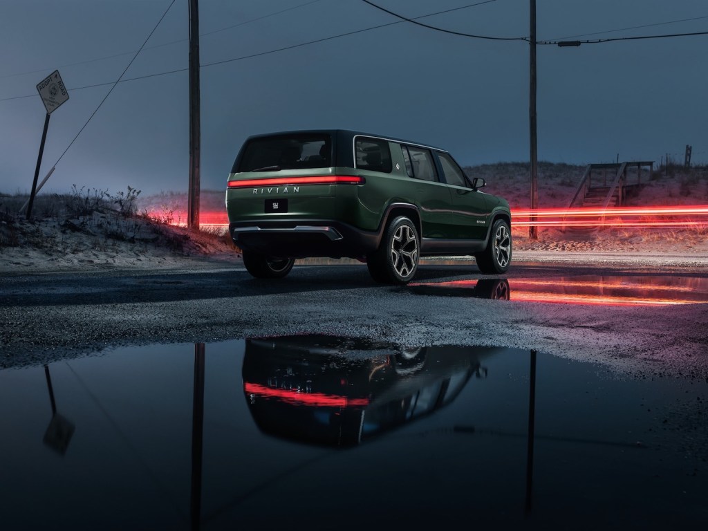 This is a promo photo of a green 2022 Rivian R1S electric SUV, an electric g wagon, budget-friendly 