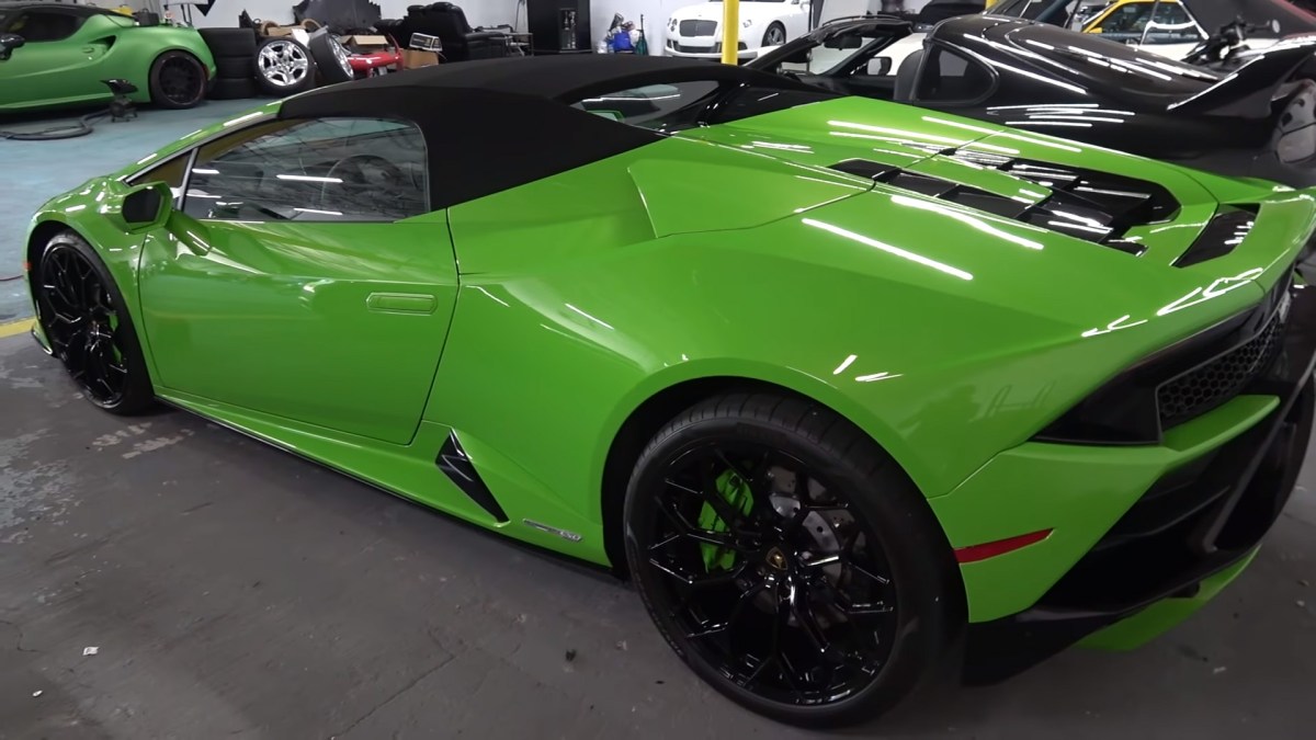 A bright green Lamborghini Huracan Evo convertible with black wheels. One of Rob Ferretti's many supercars.
