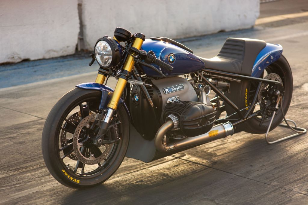 The blue Roland Sands BMW R 18 Dragster on a rear-wheel stand on a dragstrip