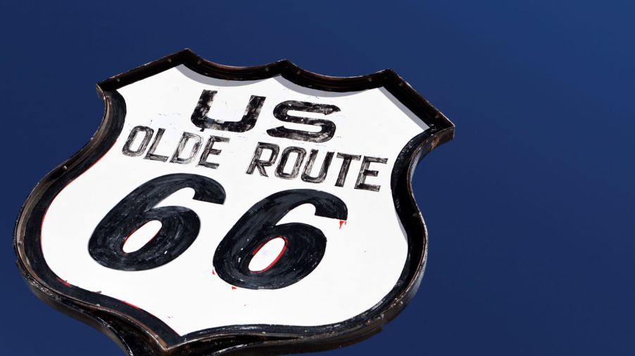 Route 66 sign in against a blue sky.