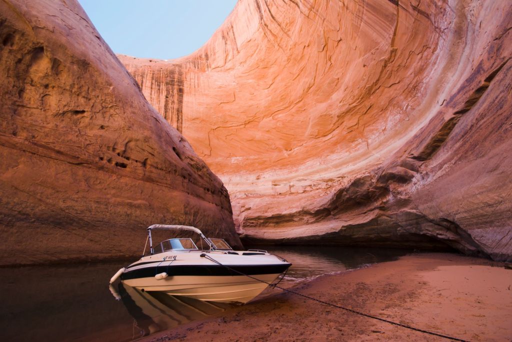 A speedboat parked in Lake Powell within the Glen Canyon National Recreation Area
