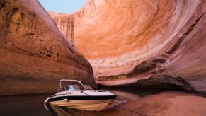 A speedboat parked in Lake Powell within the Glen Canyon National Recreation Area