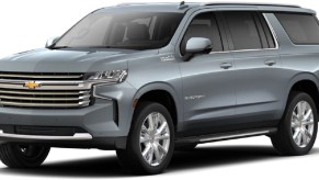 A gray 2021 Chevy Suburban against a white background.