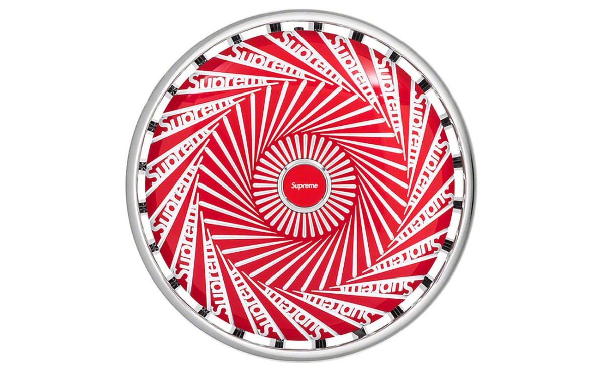 Supreme DUB Spinner Rim against a white background from a front on view revealing the Supreme logo on the wheel face.