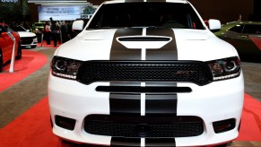 A white Dodge Durango SRT with black racing stripes is on display at the 110th Annual Chicago Auto Show at McCormick Place in Chicago, Illinois on February 9, 2018.