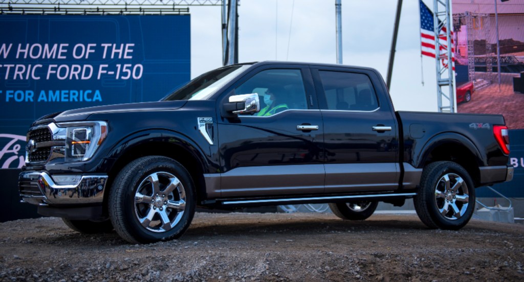 A black Ford F-150 4x4 is parked. 