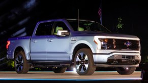 A gray Ford F-150 Lightning performance pickup truck is revealed at a livestream event at Ford World Headquarters on May 19, 2021 in Dearborn, Michigan. The truck will be built at the all-new Ford Rouge Electric Vehicle Center in Dearborn starting in the Spring of 2022,