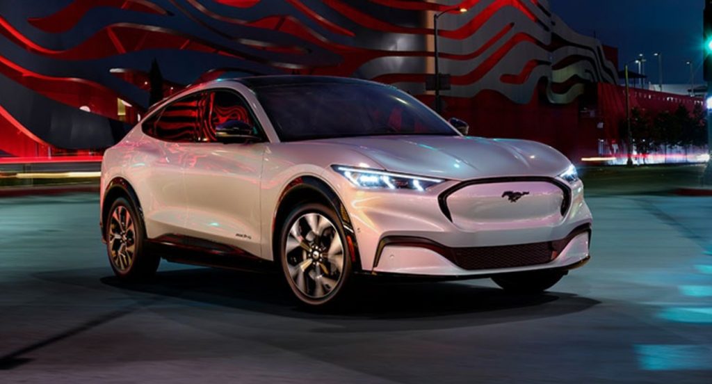 A white Ford Mustang Mach-E electric SUV.