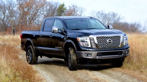 A black Nissan Titan pickup truck.