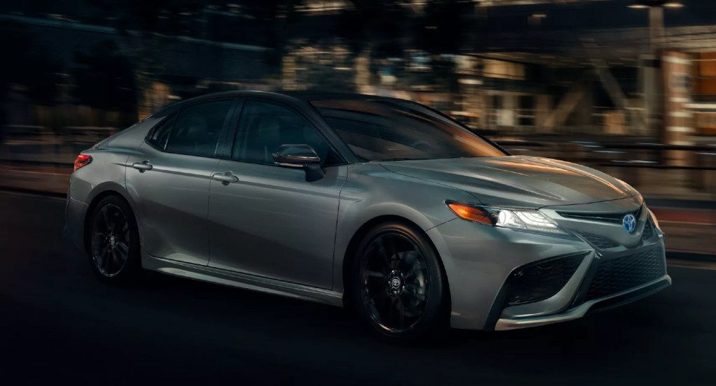 A silver Toyota Camry XSE Hybrid. 