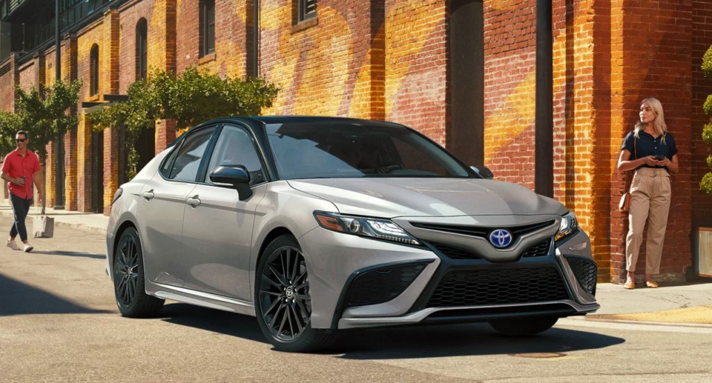 A silver Toyota Camry XSE Hybrid. 