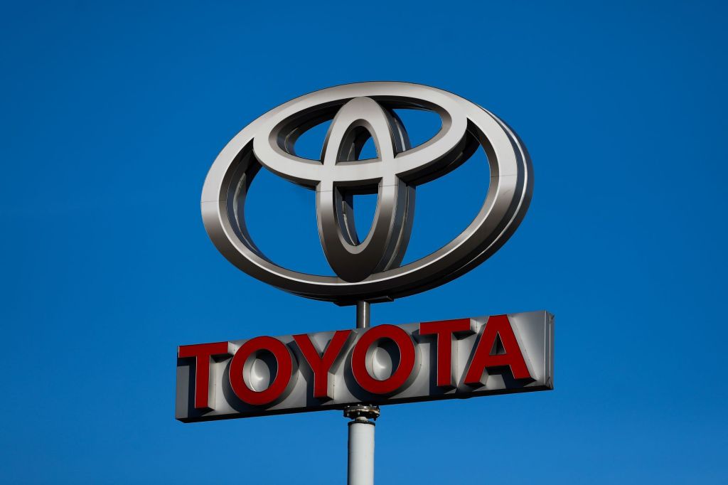 Toyota Sign with the logo on top and Toyota written in red. 