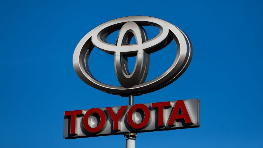Toyota Sign with the logo on top and Toyota written in red.