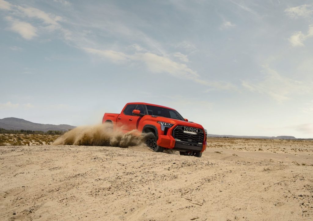 This is a promo photo of a 2022 Toyota Tundra TRD Pro offroading. This high-speed offroad truck is a cost-effective Ford Raptor