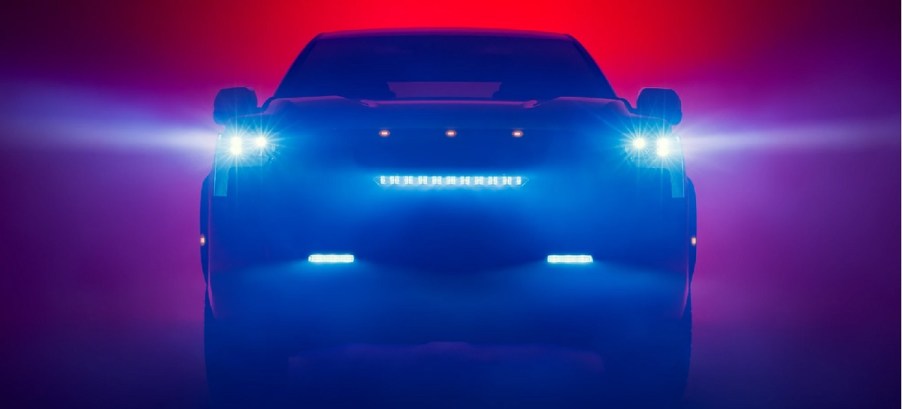 A shadowy 2022 Toyota Tundra with a colorful background.