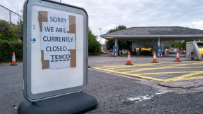 A Tesco petrol station with a sign that reads "sorry we are currently closed". The station is closed due to the fuel shortage in the UK currently